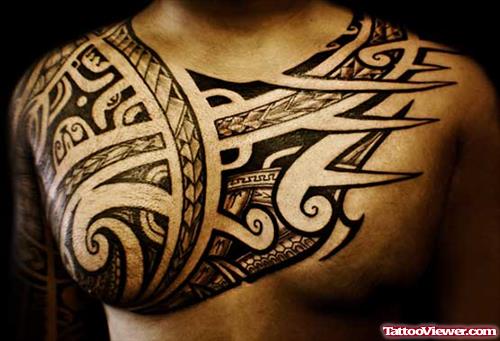 Black Ink Tribal Tattoo On Man Chest