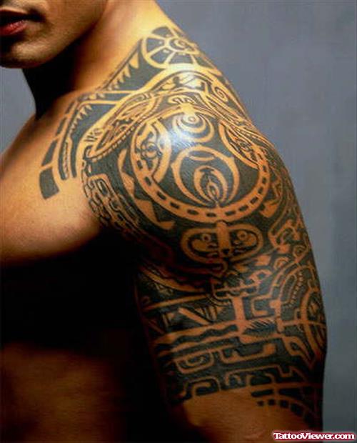 Left Shoulder And Half Sleeve Tribal Maori Tattoo