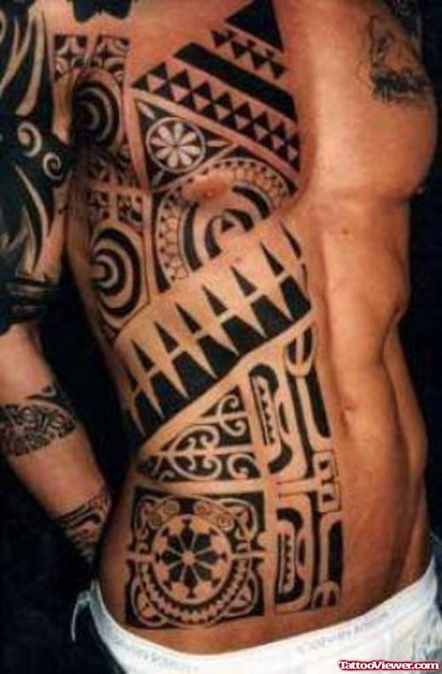 Hawaiian Black Ink Tribal Tattoo On Man Chest