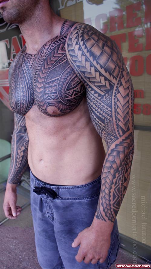 Grey Ink Polynesian Tribal Tattoo On Chest And Left Sleeve