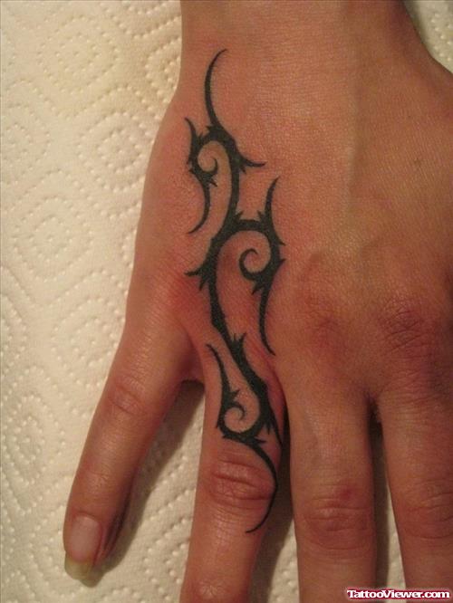 Tribal Tattoo On Hand And Finger