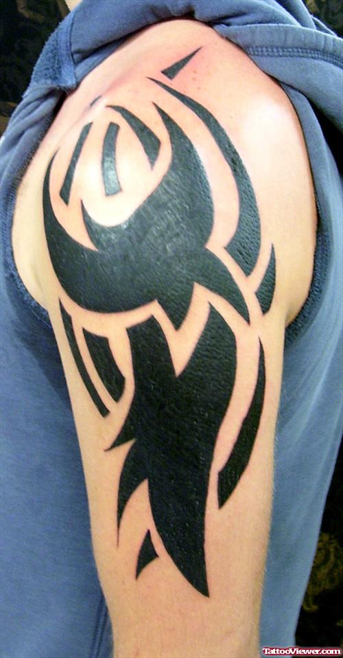 Attractive Black Ink Tribal Tattoo On Left Half Sleeve