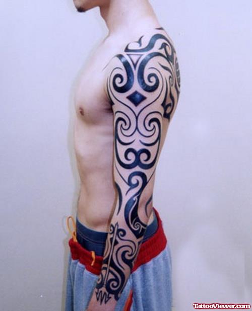 Amazing Left sleeve Black Ink Tribal Tattoo For Men