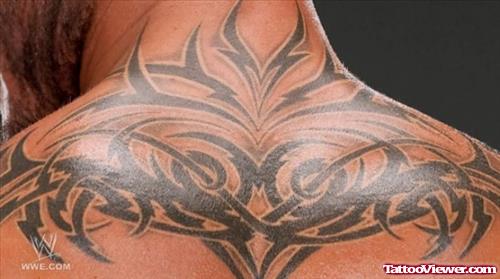 Amazing Black Ink Tribal Tattoo On Upperback