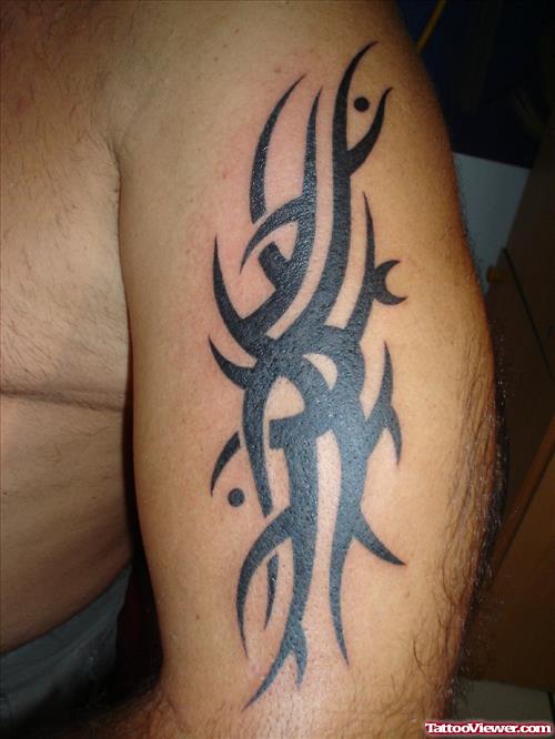 Amazing Black Ink Tribal Tattoo On Half Sleeve