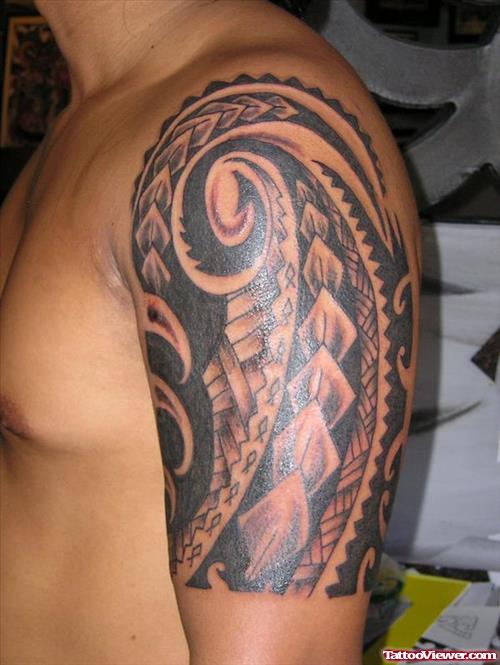 Hawaiian Tribal Tattoo On Man Left Half Sleeve