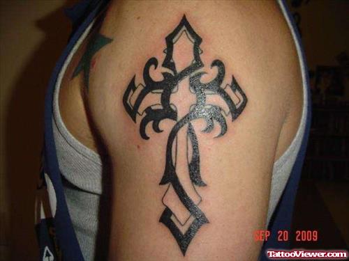 Cross And Tribal Black Ink Tattoo On Left Half Sleeve