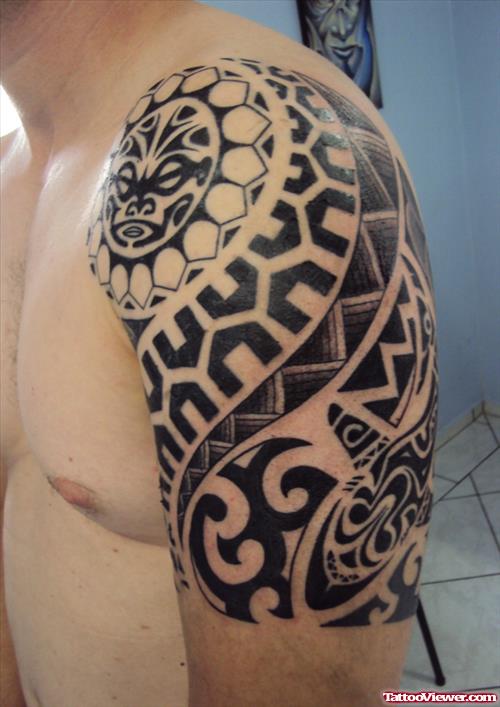 Awesome Black Ink Tribal Tattoo On Left Half Sleeve