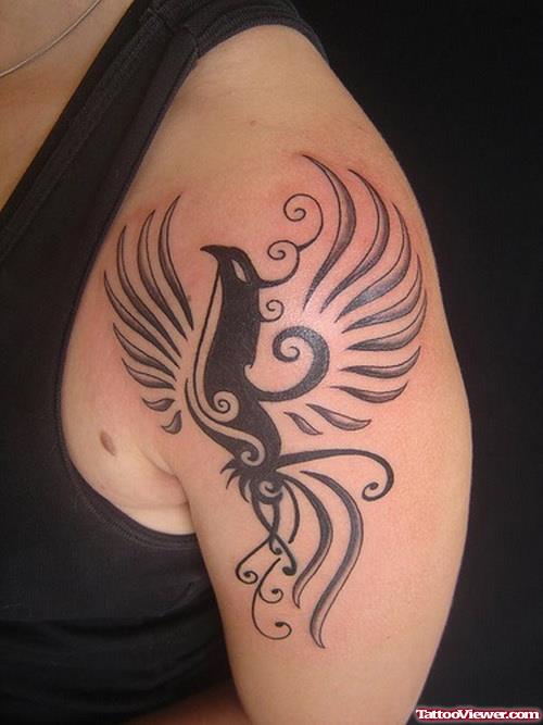 Tribal Bird Flying Tattoo On Left Shoulder