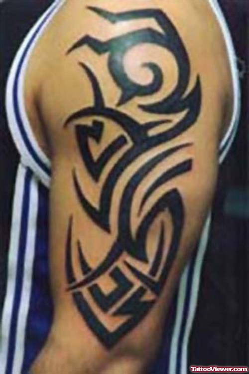 Man With Left Bicep Tribal Tattoo