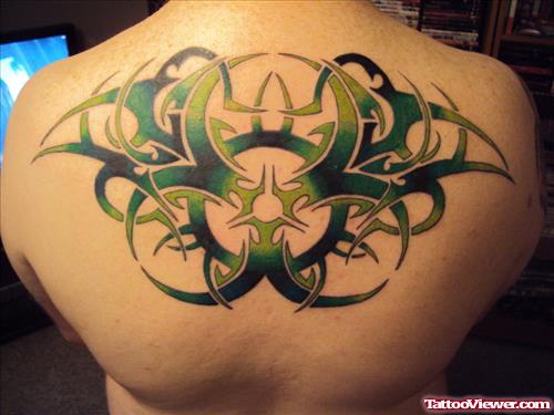 Green Ink Tribal Tattoo On Upperback