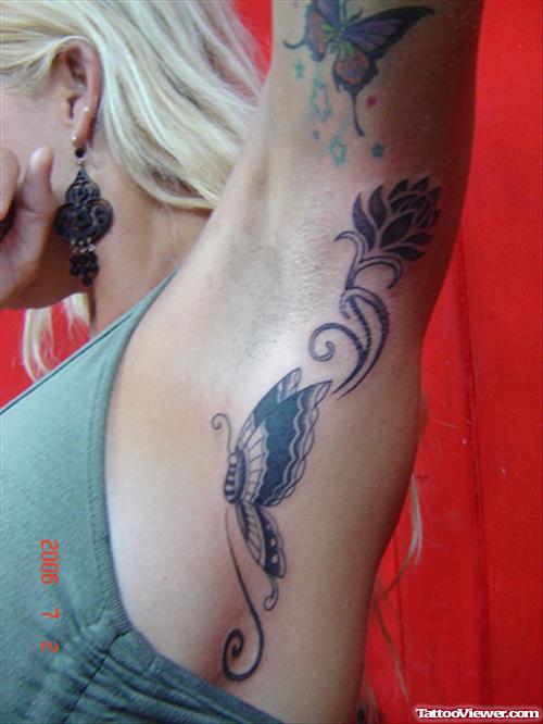 Grey Ink Butterfly And Tribal Flower Tattoo On Armpit