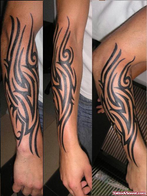 Black Ink Tribal Tattoo On Right Arm