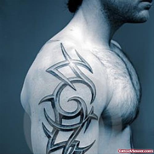 Amazing Grey Ink Tribal Tattoo On Man Right Shoulder