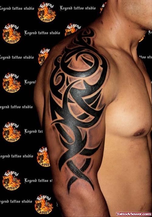 Black Ink Half Sleeve Tribal Tattoo For Men