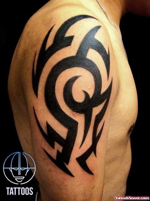 Attractive Black Ink Tribal Tattoo On Right Half Sleeve