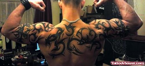 Tribal Tattoo On Muscles And Upperback