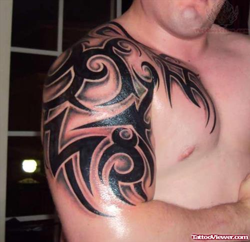 Awesome Tribal Tattoo On Shoulder And Half Sleeve