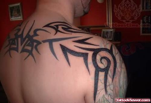 Tribal Tattoo On Upperback And Shoulder