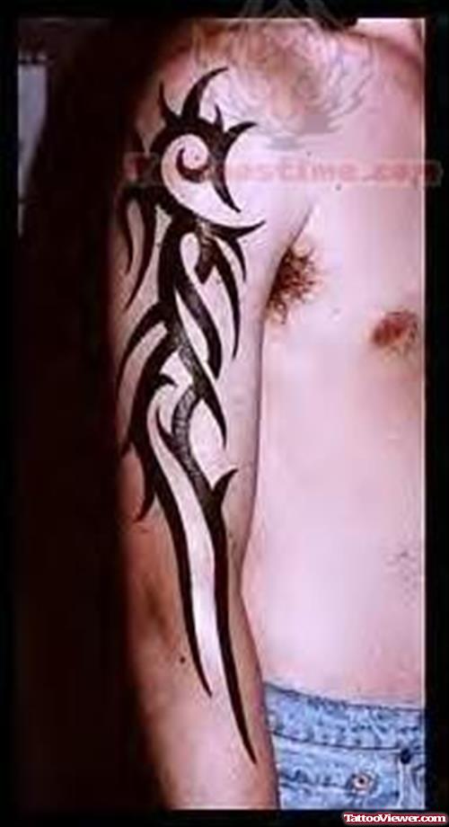 Shining Black Tribal Tattoo On Right Arm