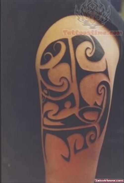 Black Tribal Tattoo On Biceps