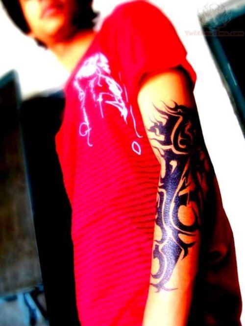 Tribal Dragon Tattoo On Arm