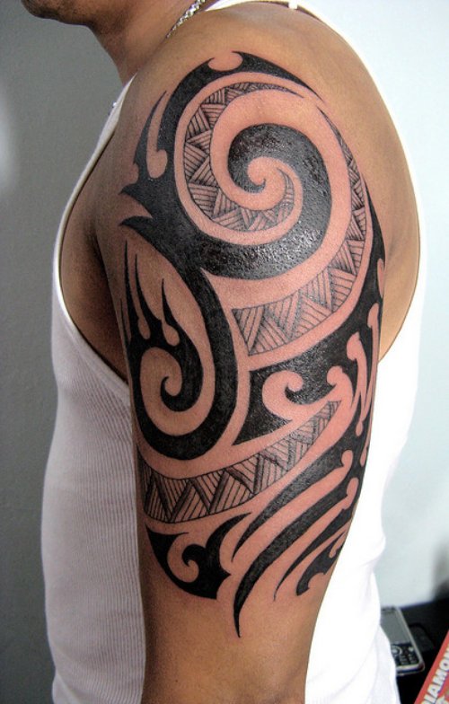Black Ink Tribal Tattoo On Left Shoulder and Bicep