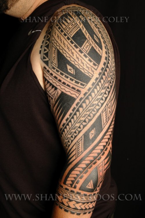 Amazing Black Ink Tribal Tattoo On Left Sleeve