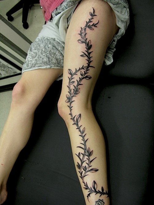 Tribal Tattoo On Girl Left Leg