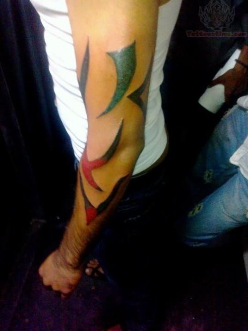 Beautiful Color Ink Tribal Tattoo On Left Arm