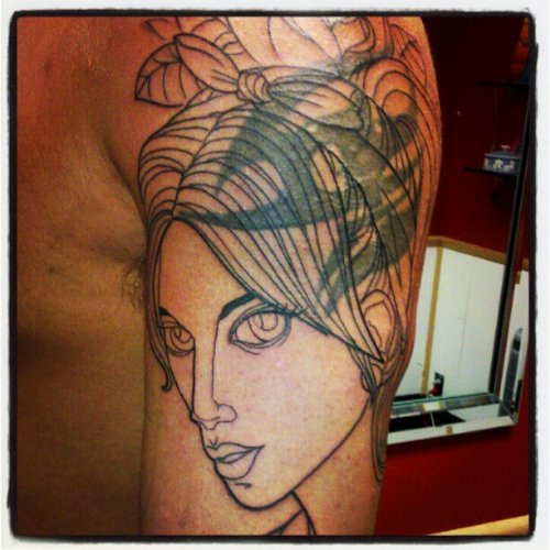 Tribal Girl Head Tattoo On Left Half Sleeve