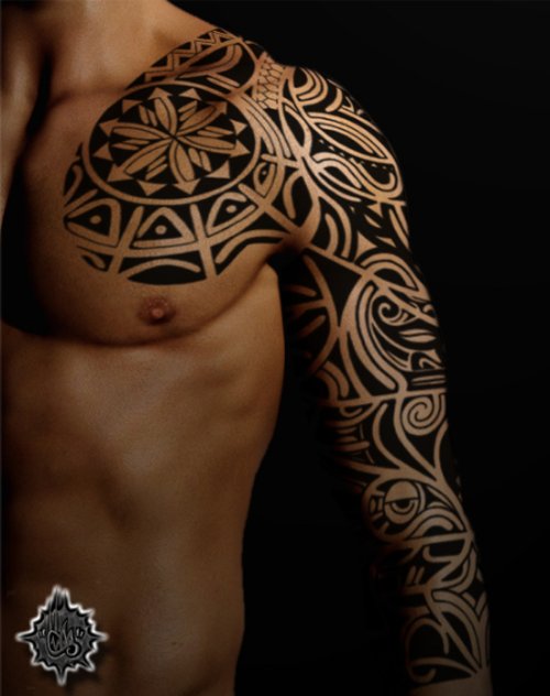 Tribal Tattoo On Chest And Left Sleeve