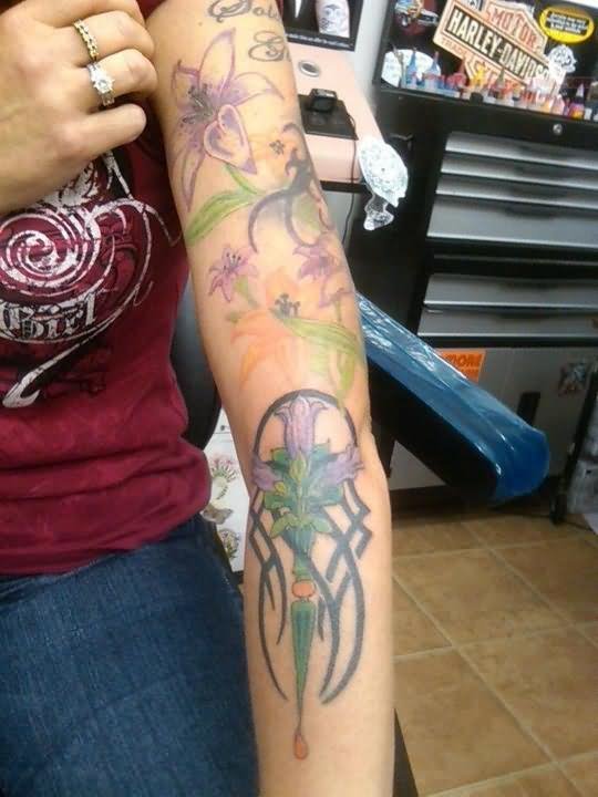 Tribal And Flower Tattoo On Arm