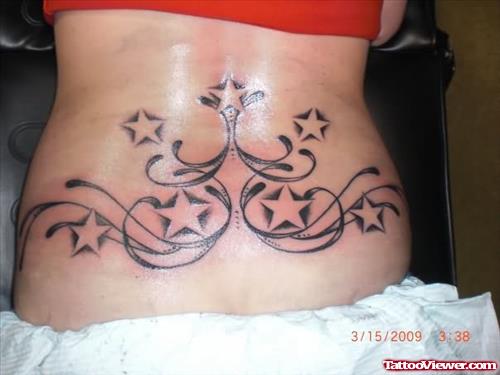 Black Squiggles And Stars Tattoo On Waist
