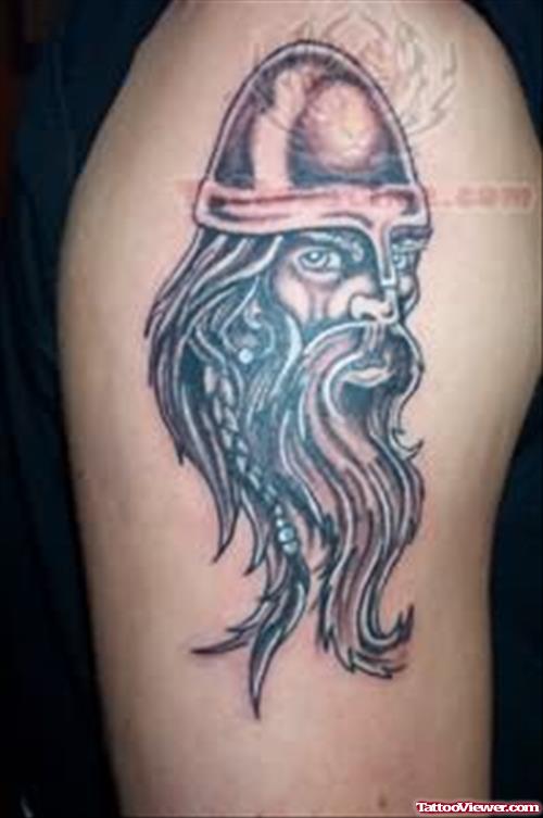 Warrior Face Tattoo On Biceps