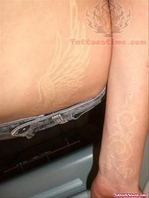 White Ink Wings Tattoo