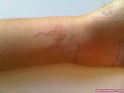 Wrist White Ink Tattoo
