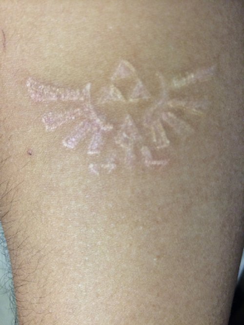 White Ink Zelda Crest Tattoo