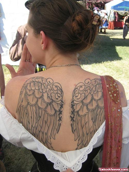 Woman With Angel Wings Tattoo