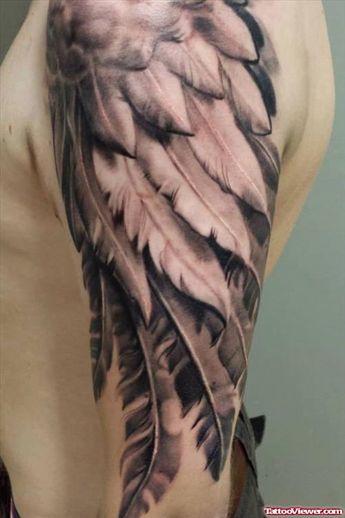 Grey Ink Feather Wings Tattoo On Half Sleeve