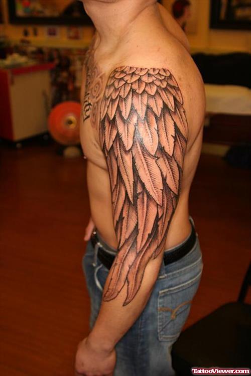 Grey Ink Angel Wing Tattoo On Left Sleeve