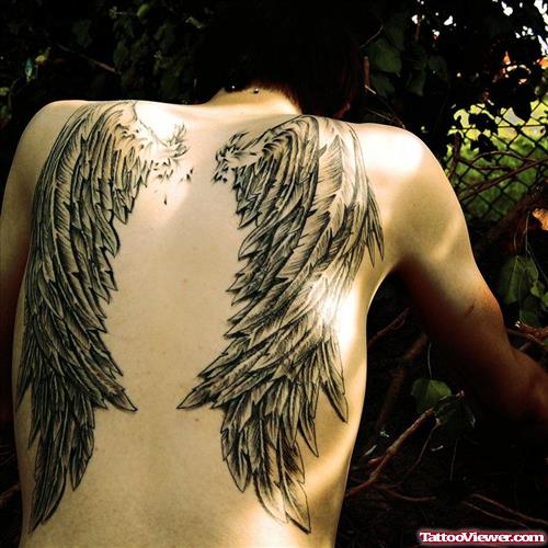 Attractive Grey Ink Wings Tattoos On Back