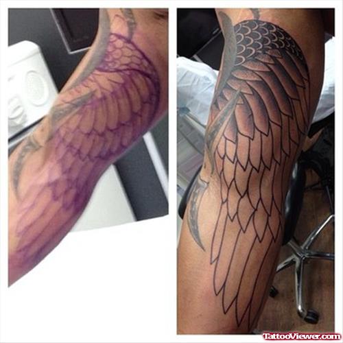 Grey Ink Wings Tattoo On Sleeve