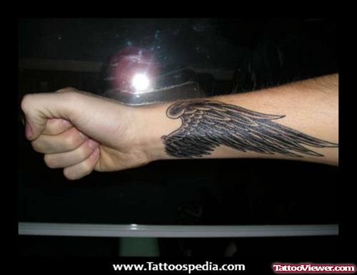 Dark Ink Wing Tattoo On Right Forearm