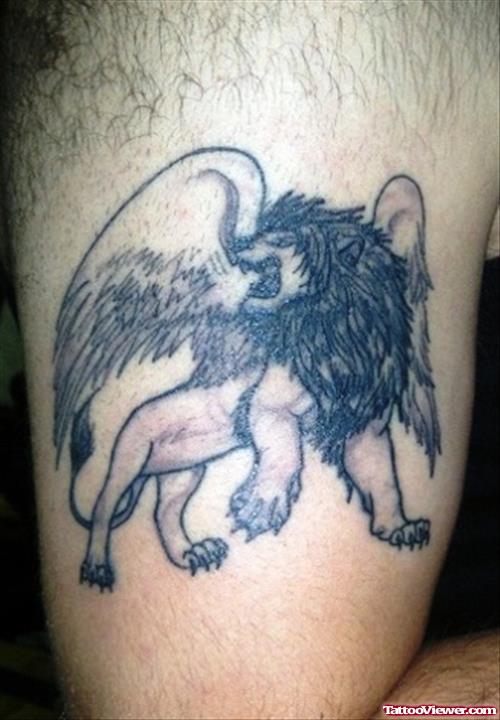 Grey Ink Winged Lion Tattoo On Half Sleeve