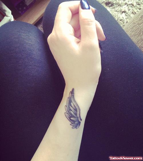 Wing Tattoo On Left Wrist