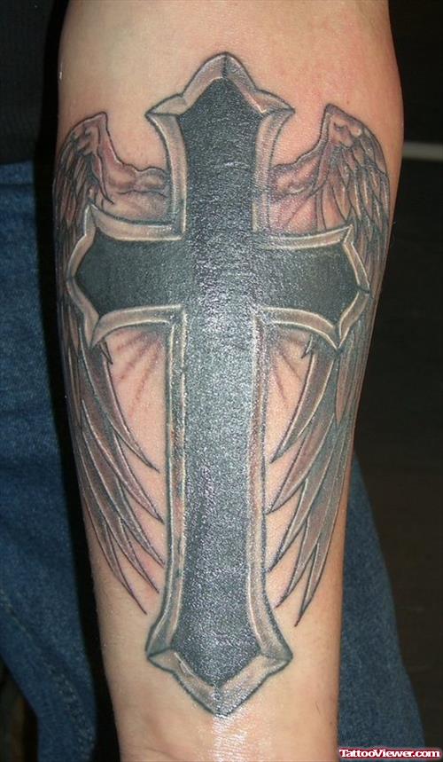 Black Ink Winged Cross Tattoo On Arm