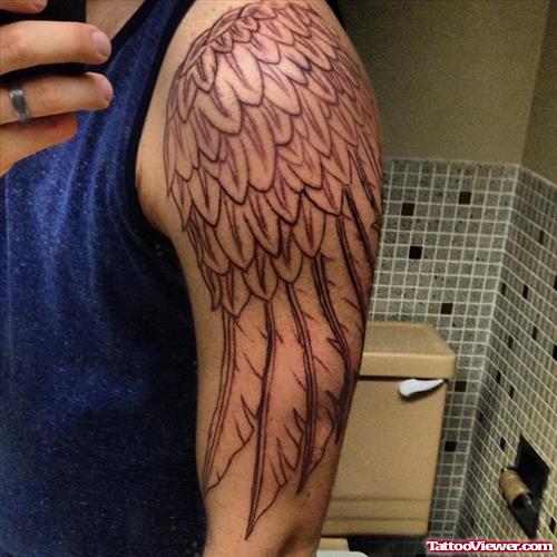 Amazing Grey Ink Angel Wing Tattoo On Left Half Sleeve