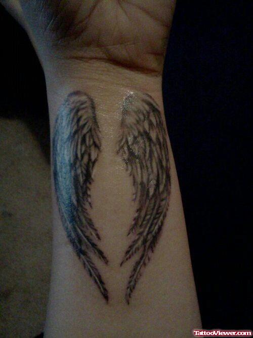 Grey Ink Wings Tattoos On Wrist