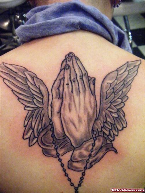Grey Ink Praying Hands With Angel Wings Tattoo On Upperback